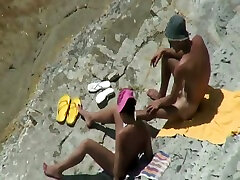 Horny couple fucking passionately on a nudist beach