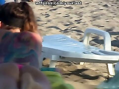 Desirable brunette girl gets fucked on the beach in MMF 3some