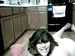 Kinky nude BBW big tits amazon girl is washing floors in the kitchen