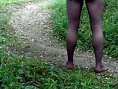 My neighbor walks around his backyard wearing pantyhose
