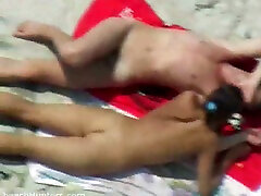 A horny young couple on the hair with milf beach having sexy time