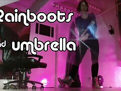Mistressonline in rain boots and with an umbrella