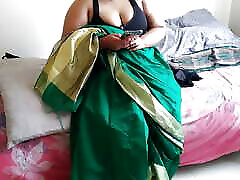 Telugu aunty in green saree with Huge Boobs on bed and fucks neighbor while watching porn on mobile - Huge cumshot