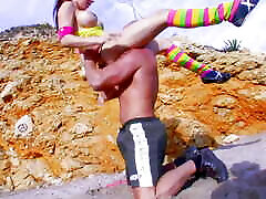 Round titted German chick gets her mouth filled on the beach