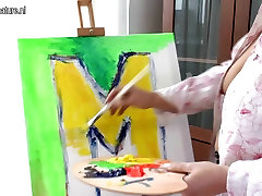 Creative mother getting naughty during painting