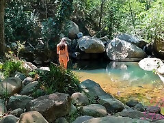 Voyeur Spying On A Girl Bathing In A Sunny Stream
