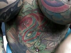 Heavily Tattooed And Pierced Biker Chick Black Widow Sucks