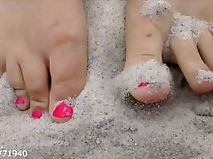 Feet and chubby plumer in the Sand at the Beach