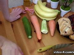 Dina has fun masturbating in her kitchen