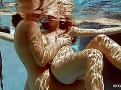 In freckled milf tube indoor pool, two stunning girls swim