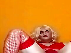 Crossdresser Felixa Branca in red lingerie mastrubating with black dildo