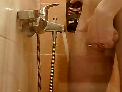 The guy washes in the shower, dreaming of sharing this place with someone else The guy washes in the shower, dreaming of sharing this place with someone else
