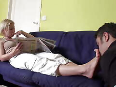 Feet smelling while reading the newspaper