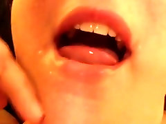 Close-up sixe dot com in mouth and swallow