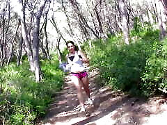 A cute runner takes a break to suck a huge brazzars film in the forest