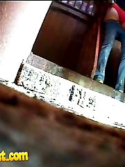 Pissing girl get busted and filmed in public loo