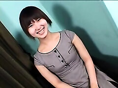 Enticing Asian ladyboy with a cute smile sensually drops he