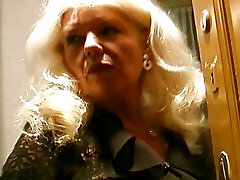 Old and huge-titted German grannie in stockings enjoys making a cock cum