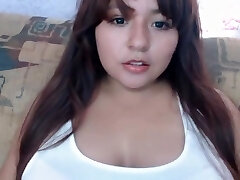 Latin chubby girl licking her boobs