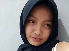 A hot slut in a hijab records a sex vid for her boyfriend where she masturbates