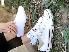 Chinese chick sprains foot in milky ankle socks and black leggings