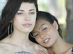Petite Asian and Russian teen lezzies outdoor posing