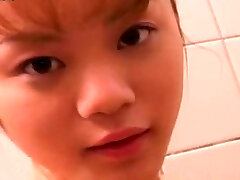 Cute petite Japanese girlie takes bathroom flashing her nice ass and titties