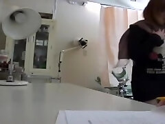 Busty Chinese minx got her snatch fucked with a toy at a gyno