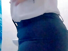 sexy milf mexican latina hot secretary does a stripteace show from the bathroom of her office and flashes her entire backside