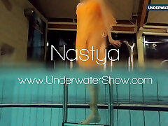 Yellow and Red clothed teen underwater