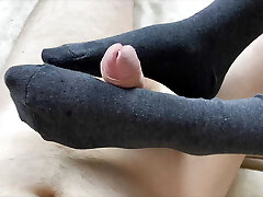 Sockjob from my gf ended with cum on her feet