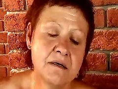 Redhead granny pounded by the machine