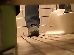 Pissing in the toilet and showing bushy slit on spy cam