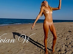 Naked Workout on the beach - a beautiful skinny milf with small tits
