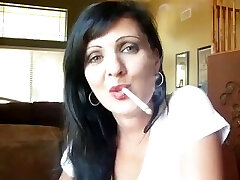 sexy brunette strings up her cigarette