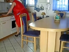 Granny fisted and pounded on a kitchen table