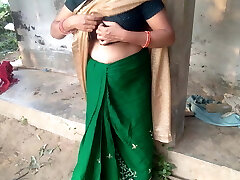 Desi Indian MILF with a hefty caboose milks her own boobs in a farmhouse