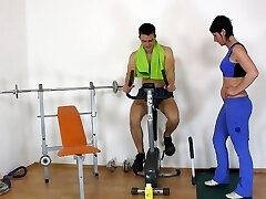 Sex-positive MILF Romana E gets fucked by her personal trainer in the gym
