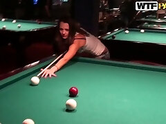 Cute brunette girl Nickel is playing games in a bar