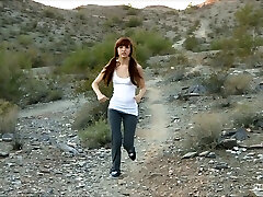 A ponytailed solo girl shows her ultra-cute ass in the mountains