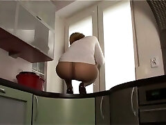 This slut likes to show off her nylon glazed ass on top of the kitchen counter