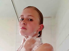 Warm blonde takes a shower