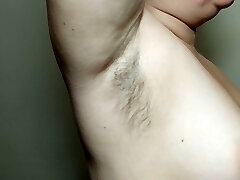Ellie shows her hairy armpits and plays with them
