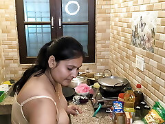 Cooking lovemaking in kitchen