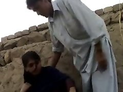 muslin teen with guy in feild