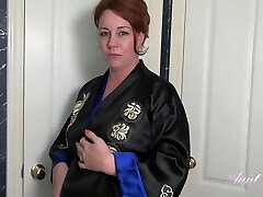 Round mature woman is having a shower in front of the camera, just for fun