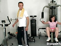 Fit gym teen rides oldie in cowgirl pose