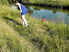 Nudist beach. Public nudity. Wondrous MILF without panties and hooter-sling sunbathes naked is not shy about fisherman. Bare in public. Milf