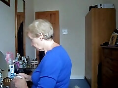 Wearing a blue microskirt and flashing her tits