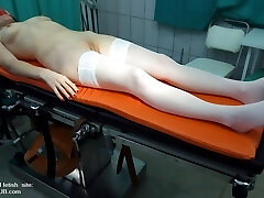 The check-up of a mature woman in doctor's office